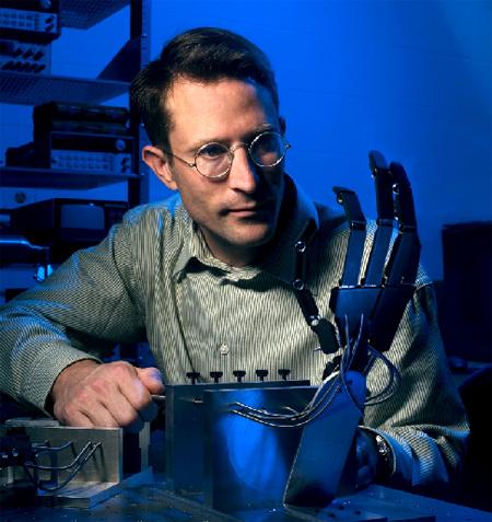 Professor Goldfarb of the Vanderbilt University with a Steam Powered Arm, photo by Daniel P Dubois of the University